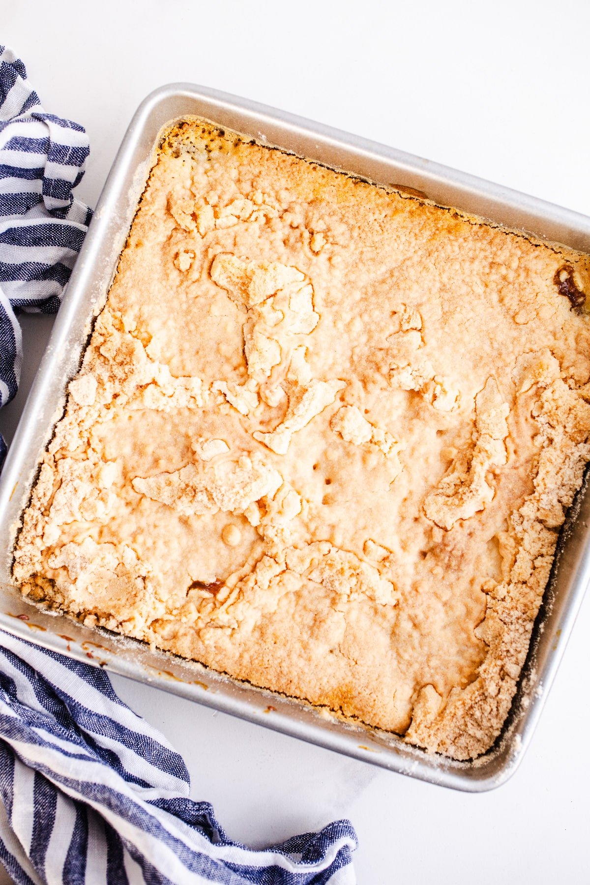 Baked apple dump cake in a baking pan.