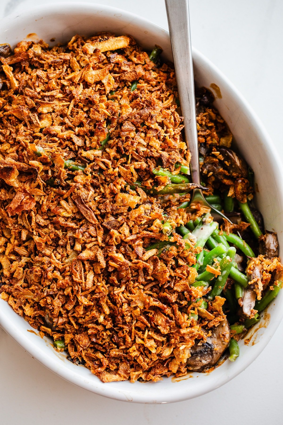 Green bean casserole in a white dish.