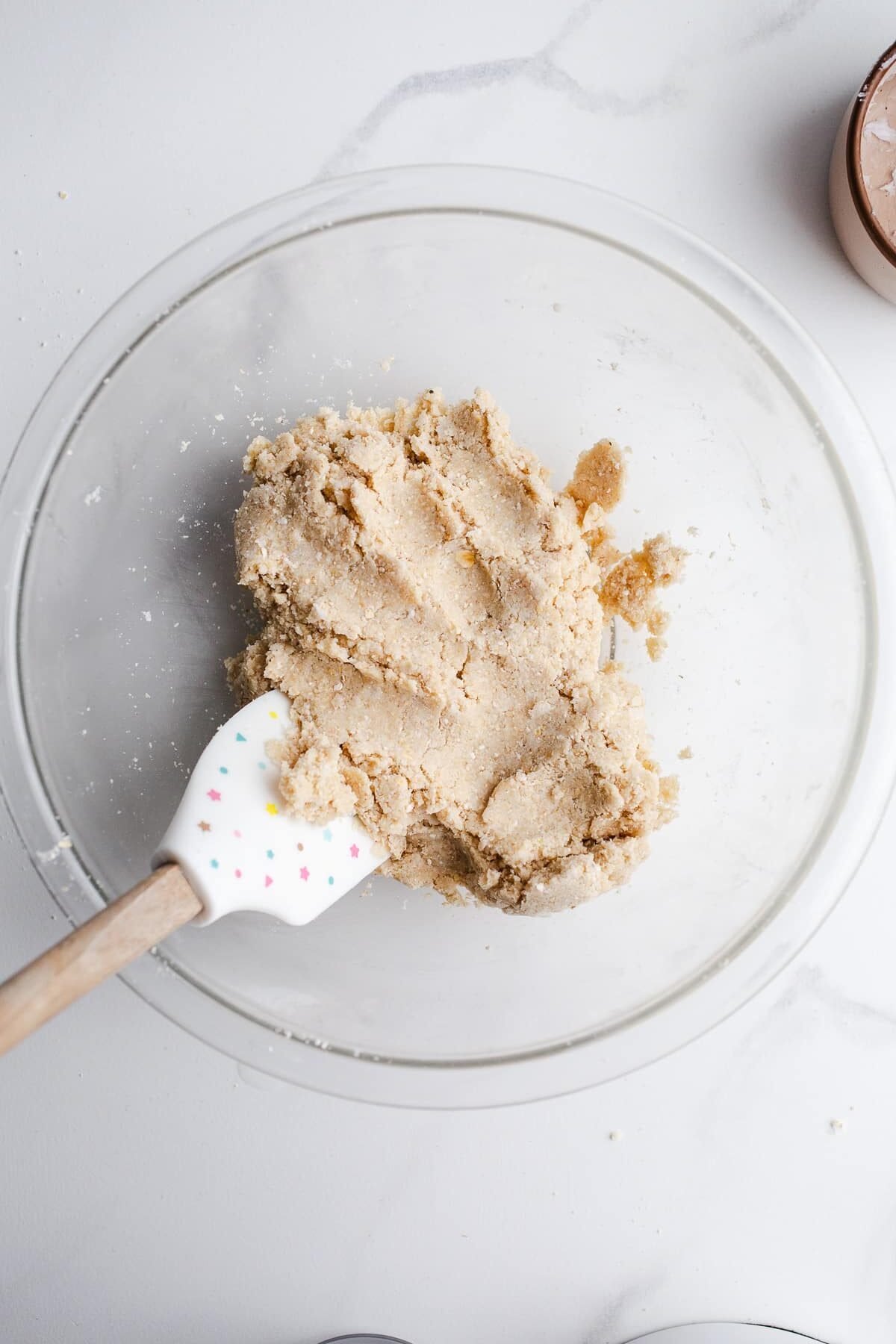 Pie crust dough in a mixing bowl.
