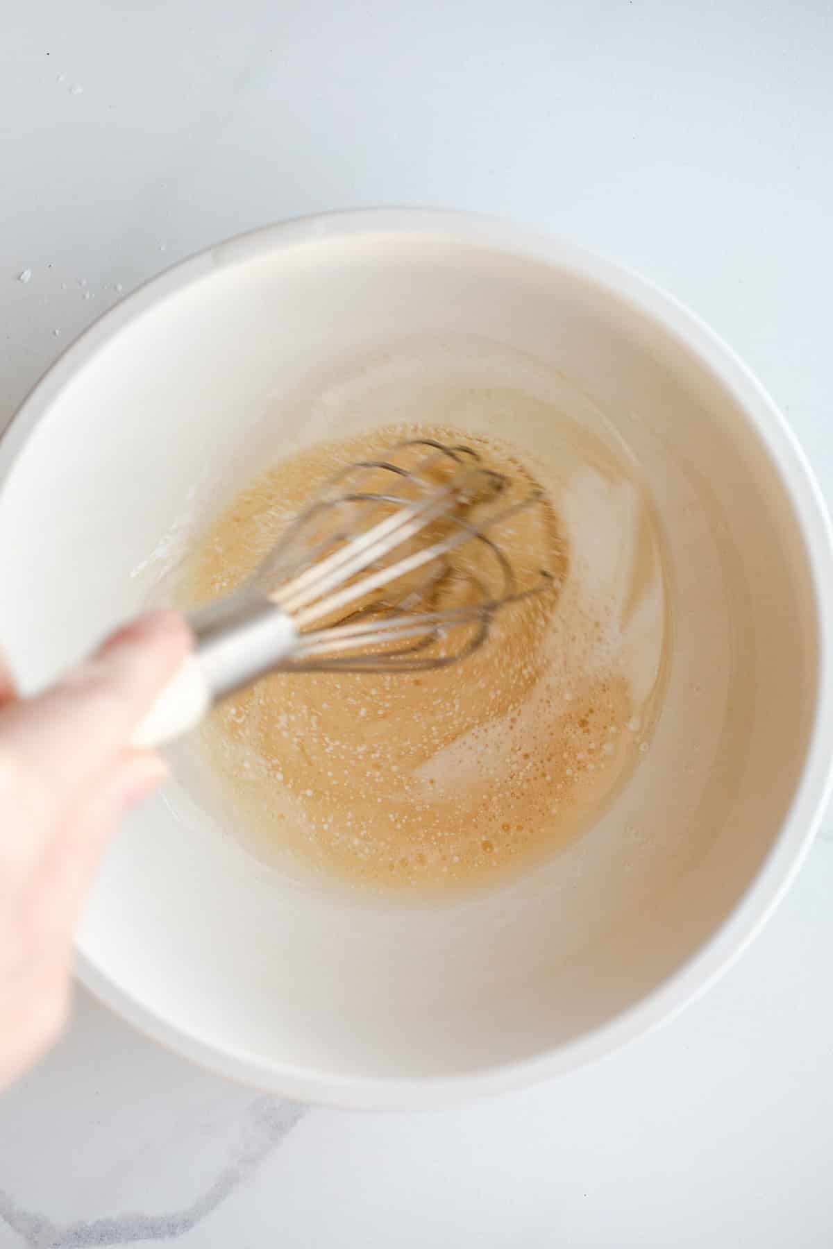 Sugar and coconut oil in a bowl.