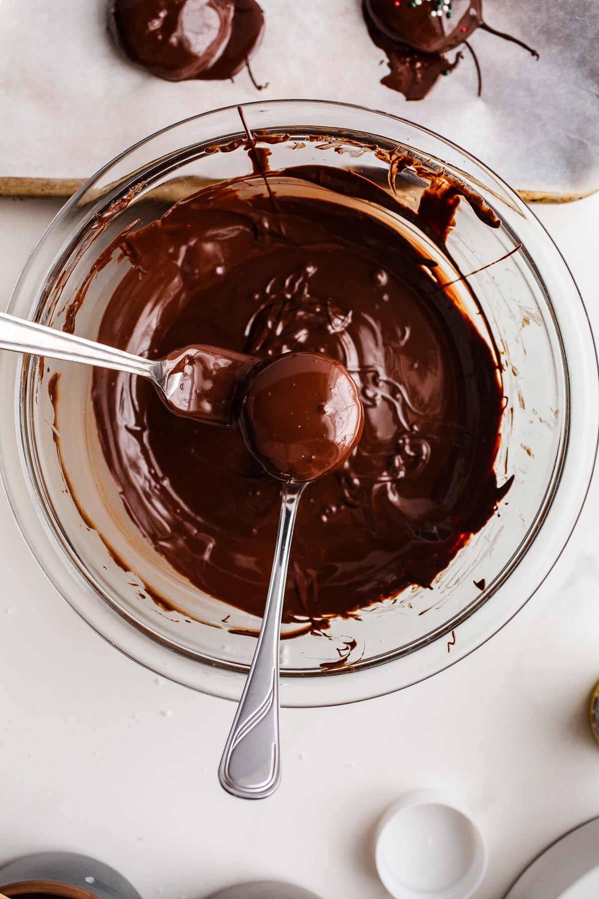 Peppermint fondant being dipped in chocolate.