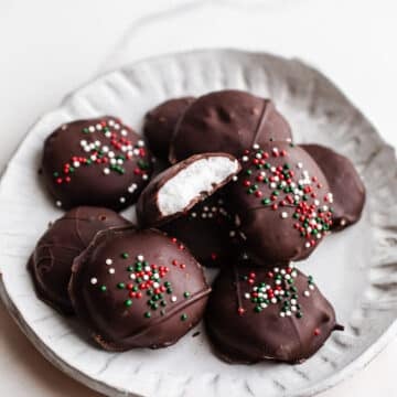 Chocolate peppermint patties on a white plate.