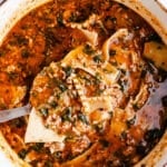 Lasagna soup in a white pot.