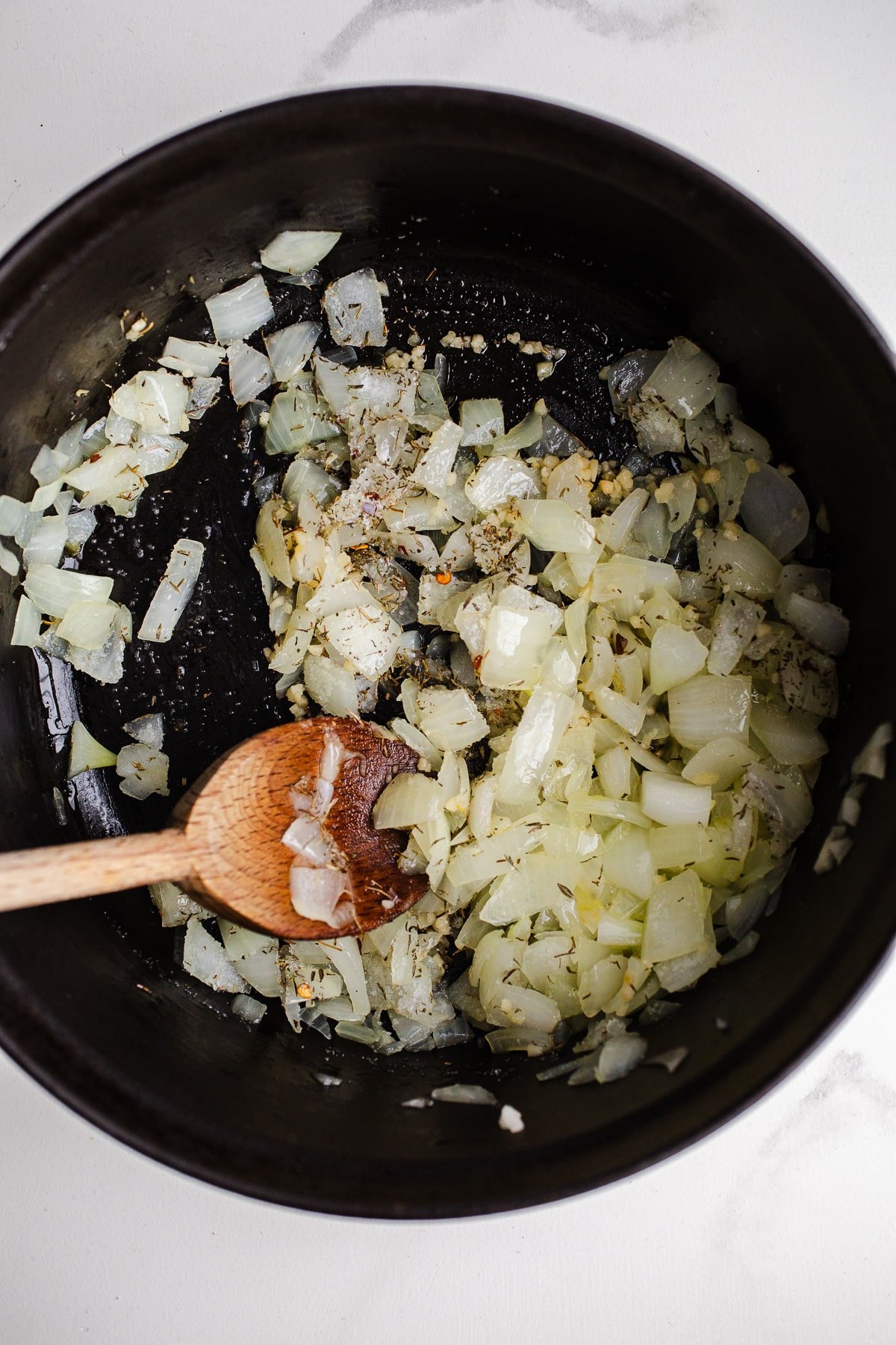 Onions and garlic in a pot.