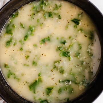 Soup with kale in a large pot.