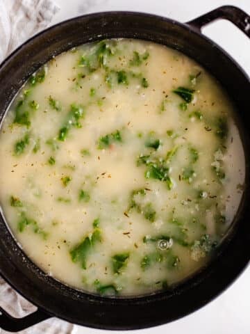 Soup with kale in a large pot.
