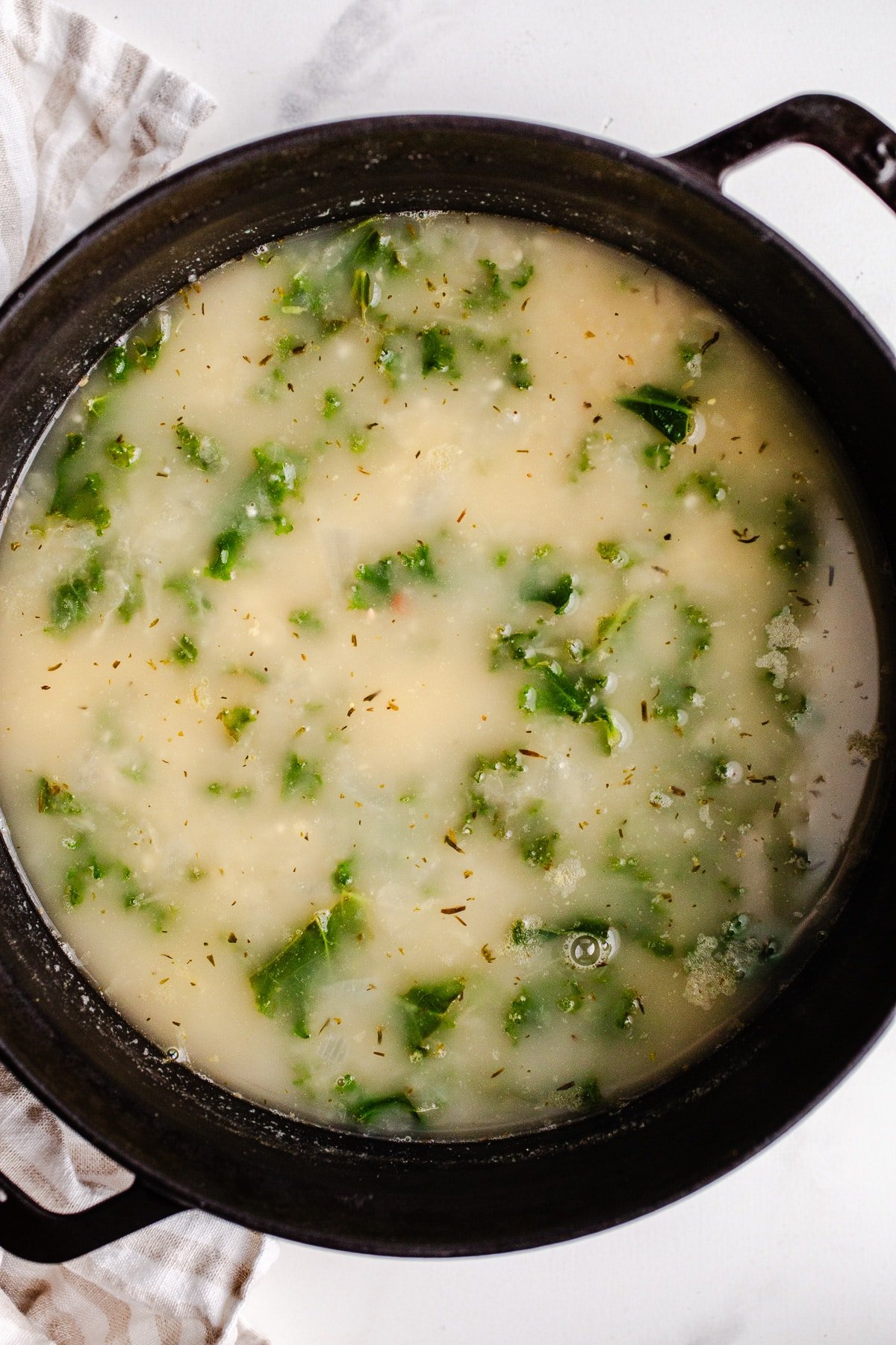 Soup with kale in a large pot.