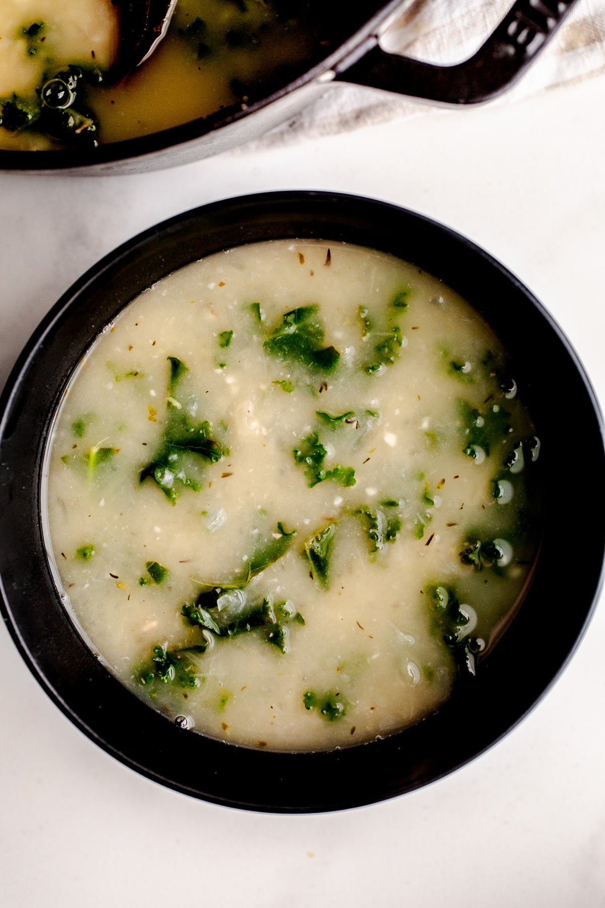 A bowl of Tuscan white bean and kale soup.