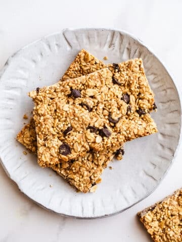 Granola bars on a white plate.
