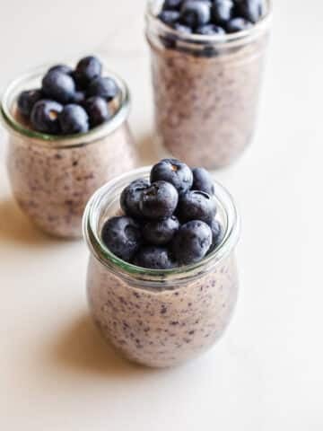 Blueberry chia pudding in mason jars.