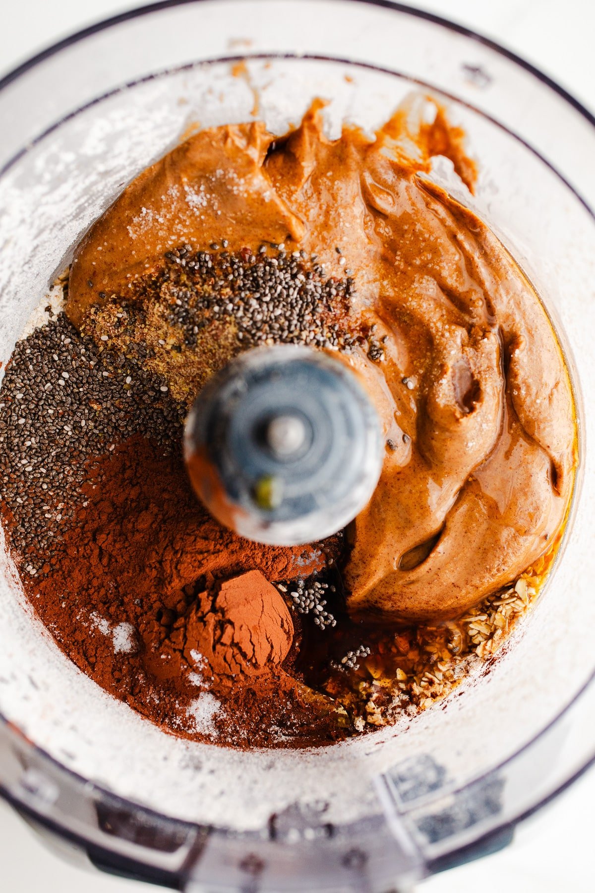 Ingredients to make protein balls in a food processor.