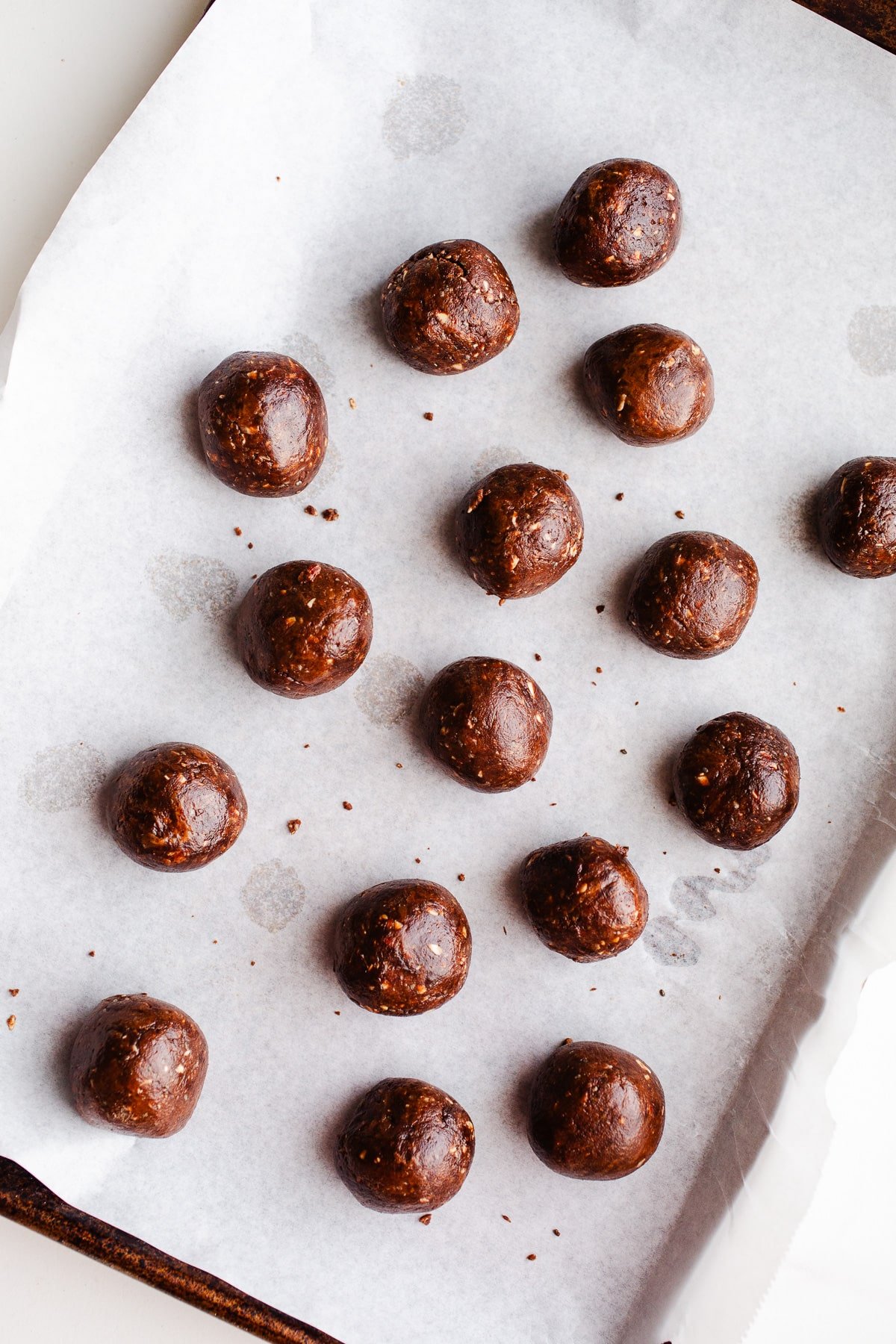 Protein balls on a baking sheet.