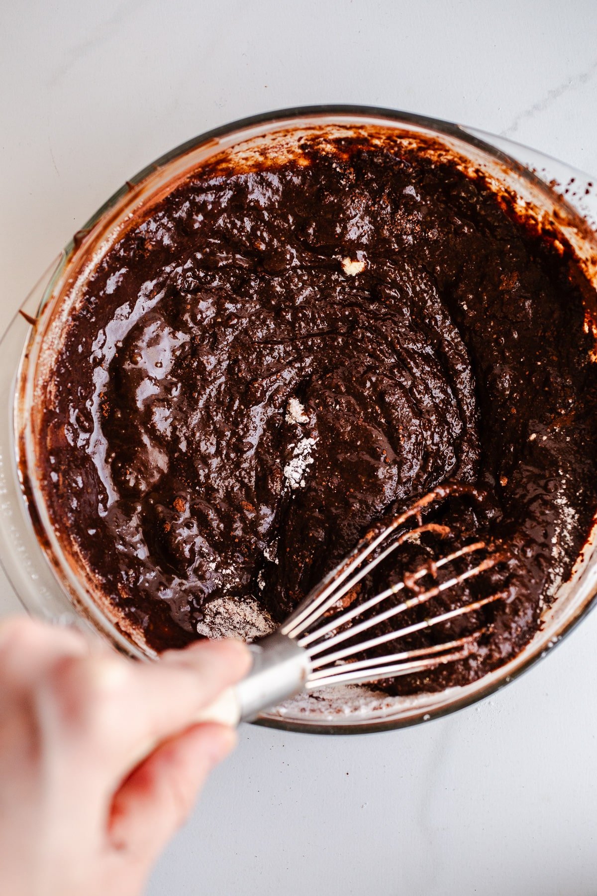 Chocolate cake batter in a mixing bowl.