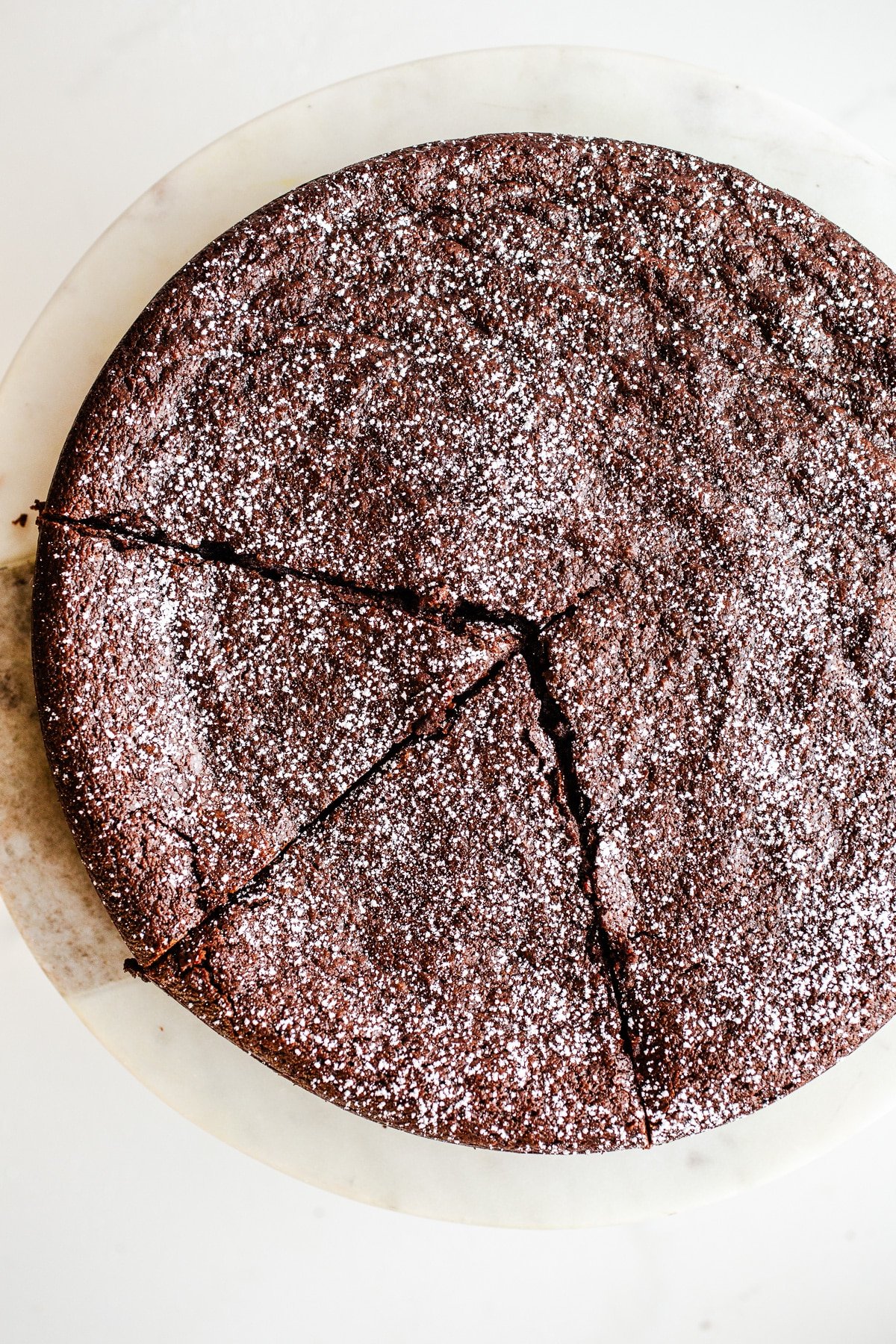 Chocolate cake dusted with powdered sugar. 