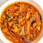 Red lentil soup and vegetables in a bowl.