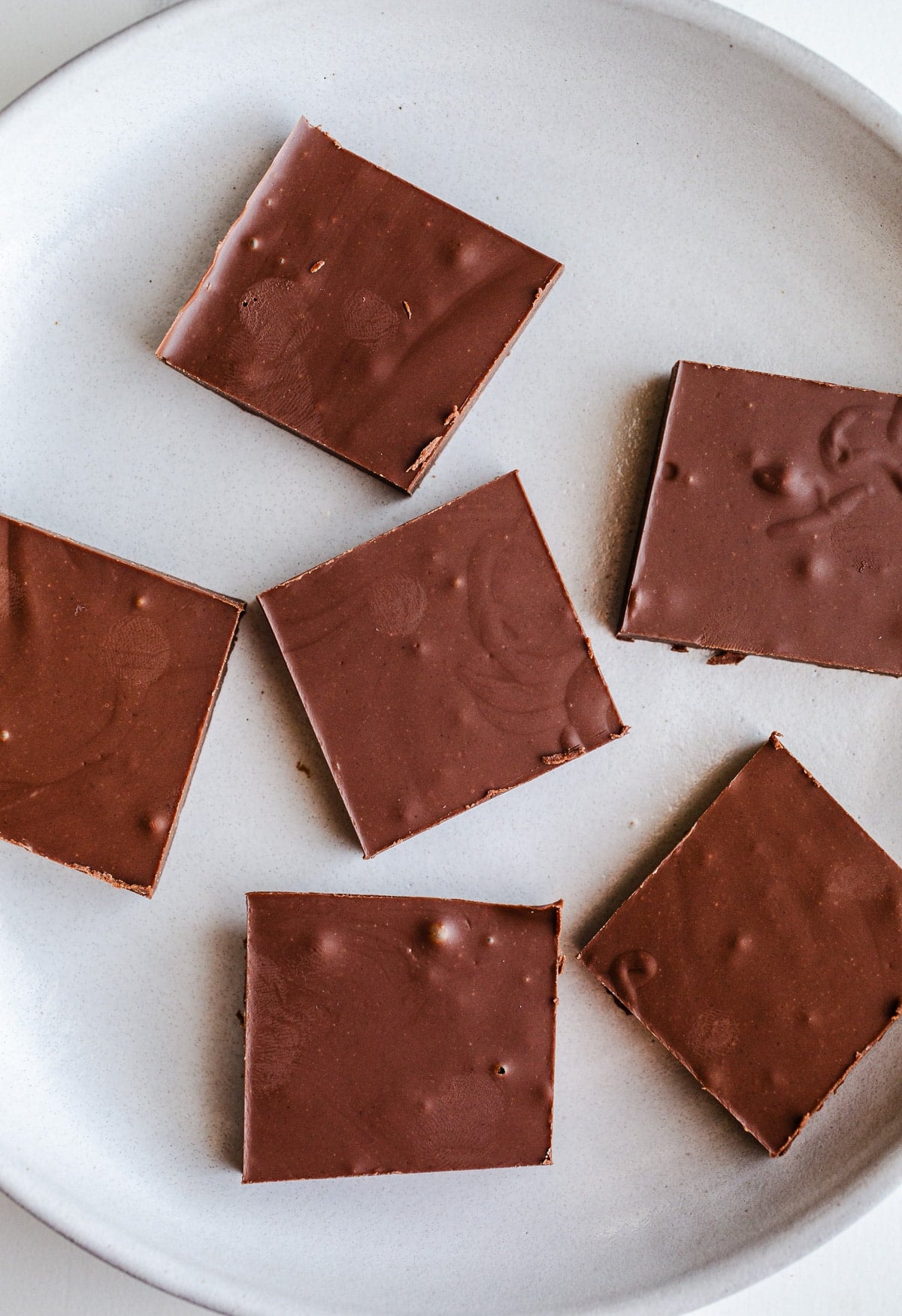 Chocolate tahini bars on a plate.
