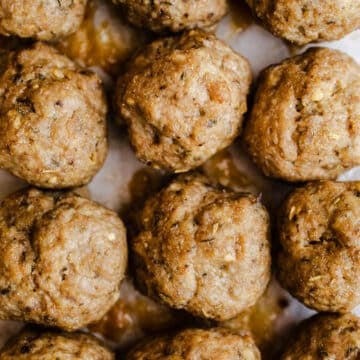 Turkey meatballs on parchment paper.