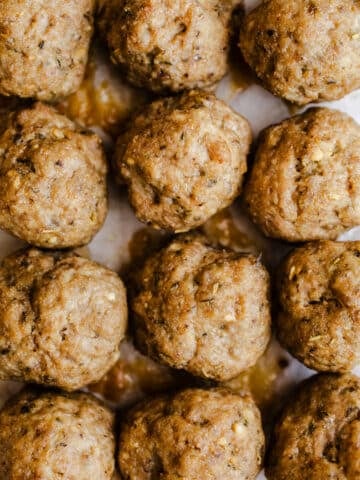 Turkey meatballs on parchment paper.