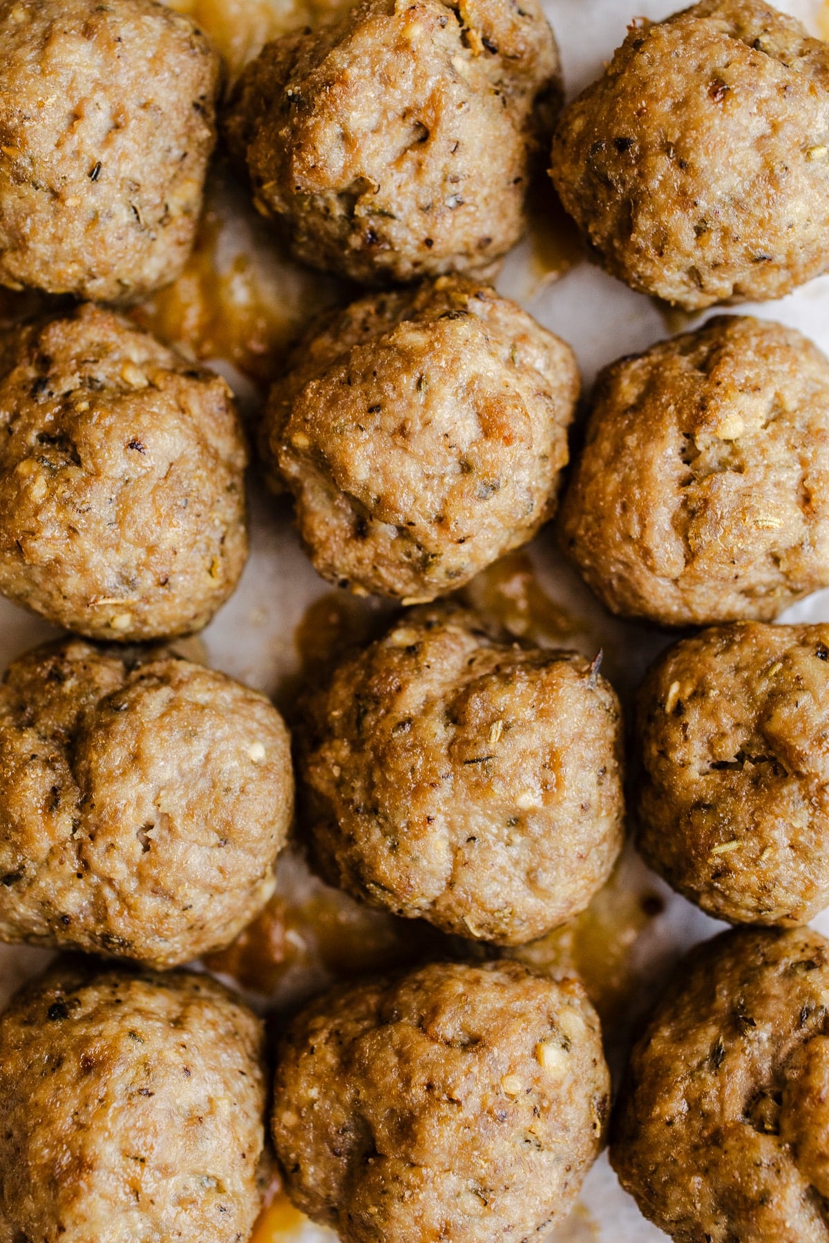 Turkey meatballs on parchment paper. 