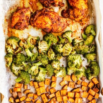 Chicken, broccoli, and sweet potatoes on a sheet pan.