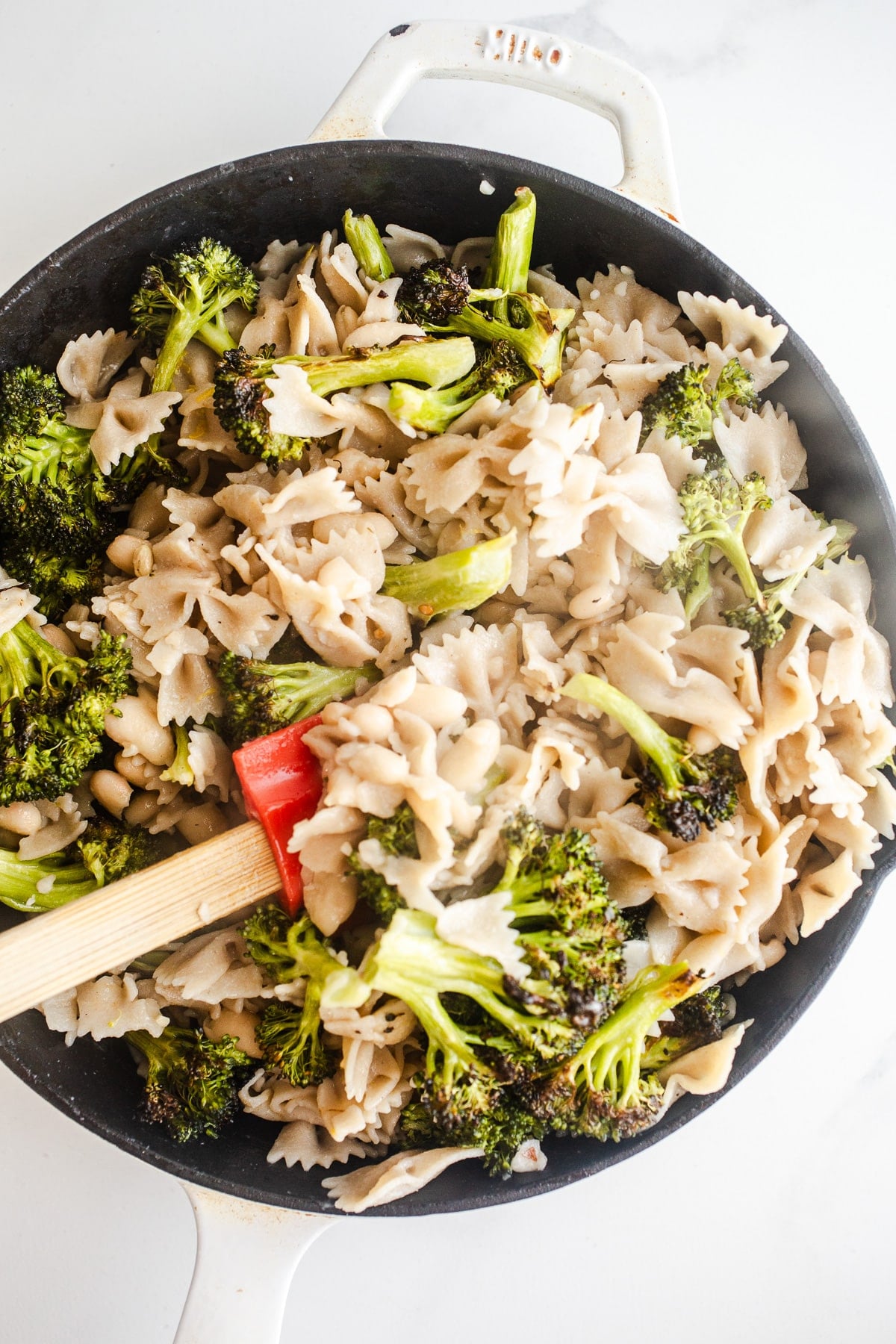 Pasta and broccoli in a saucepan.
