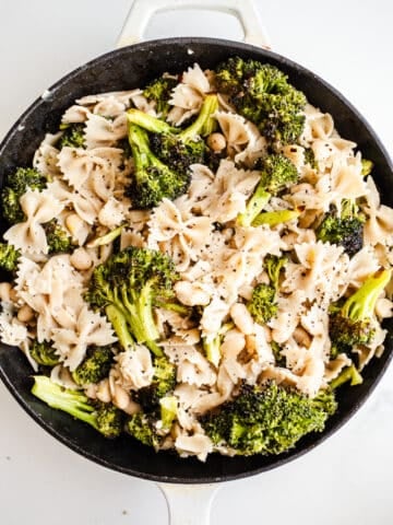 Pasta and broccoli in a skillet.