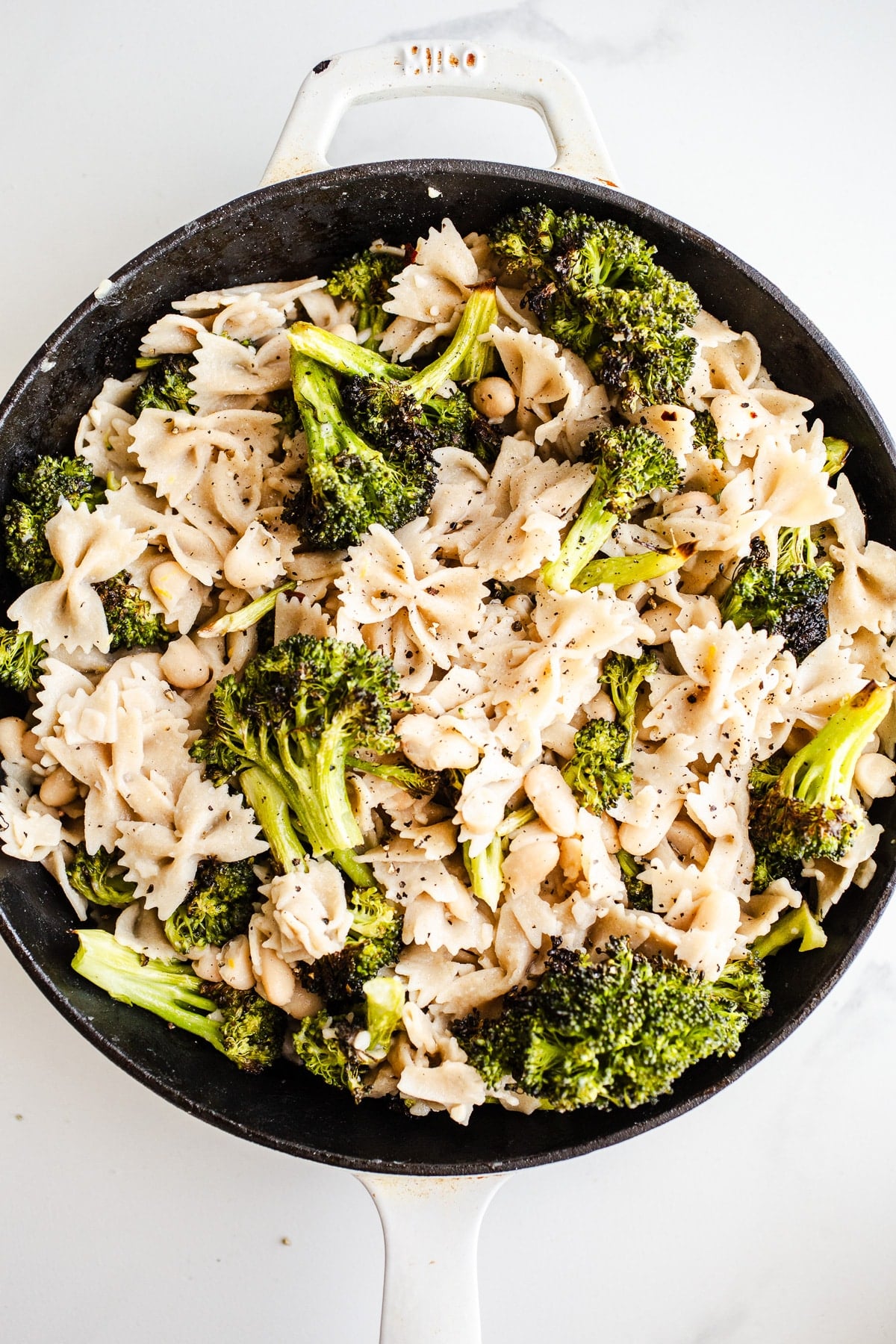 Pasta and broccoli in a skillet.