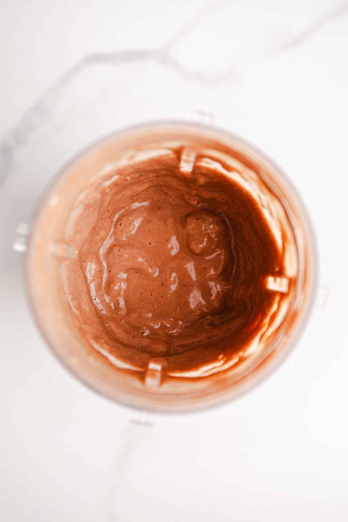 Chocolate smoothie in a blender cup.