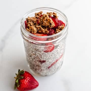 A strawberry parfait in a mason jar.