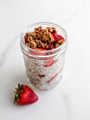 A strawberry parfait in a mason jar.
