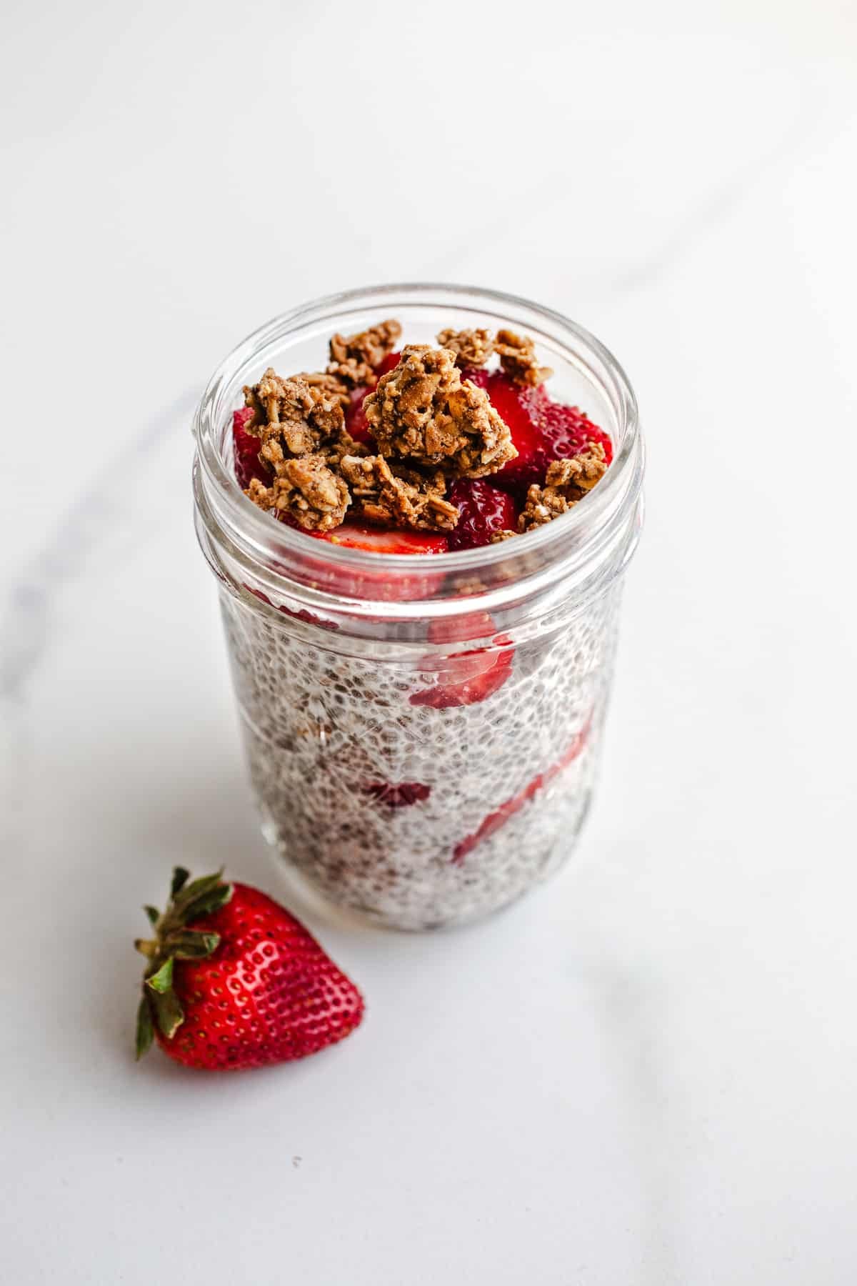 A strawberry parfait in a mason jar. 