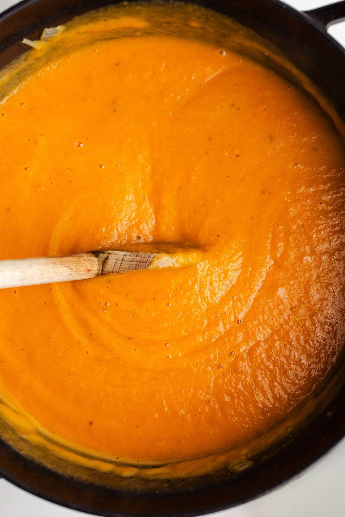 Pureed carrot soup in a pot.