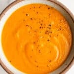 Sweet potato carrot soup in a bowl.