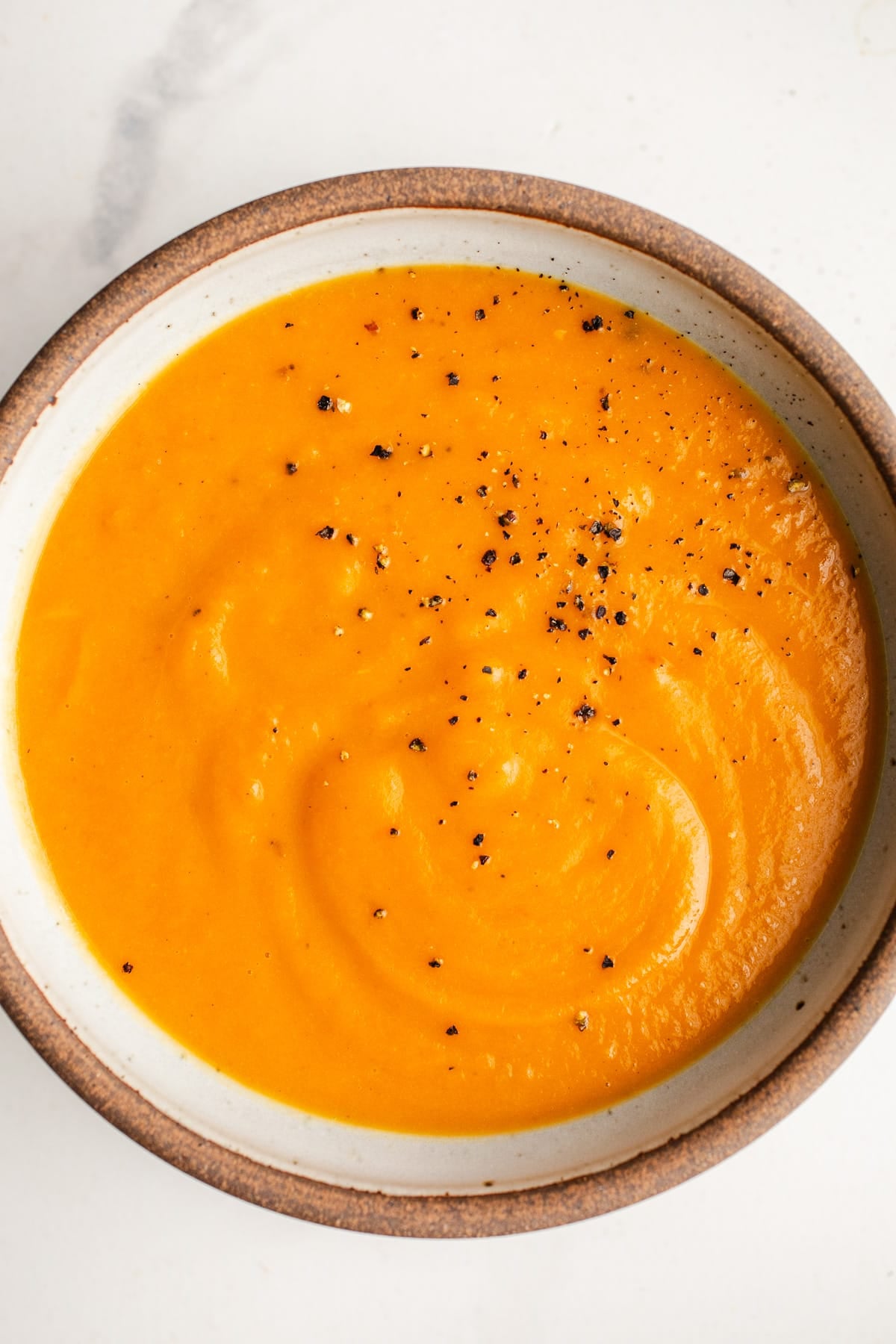 Sweet potato carrot soup in a bowl. 