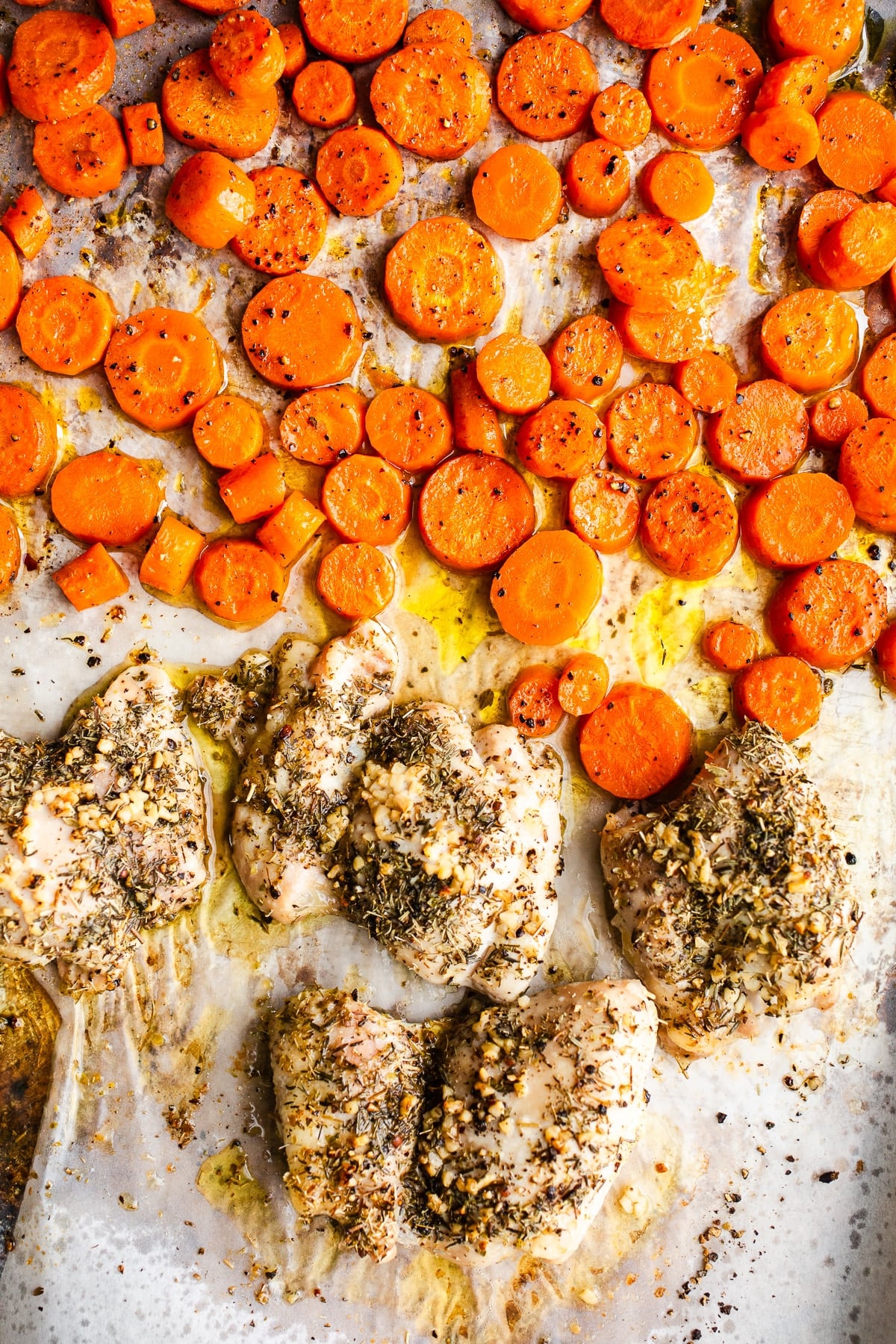 Chicken and carrots on a sheet pan.
