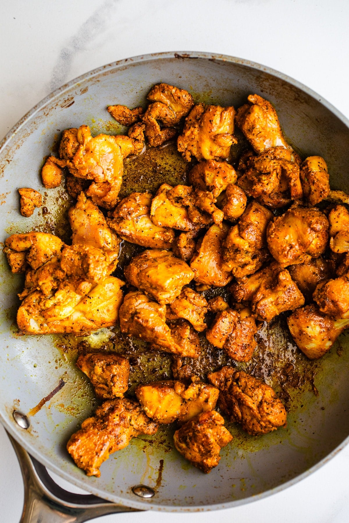 Cooked chicken in a pan.