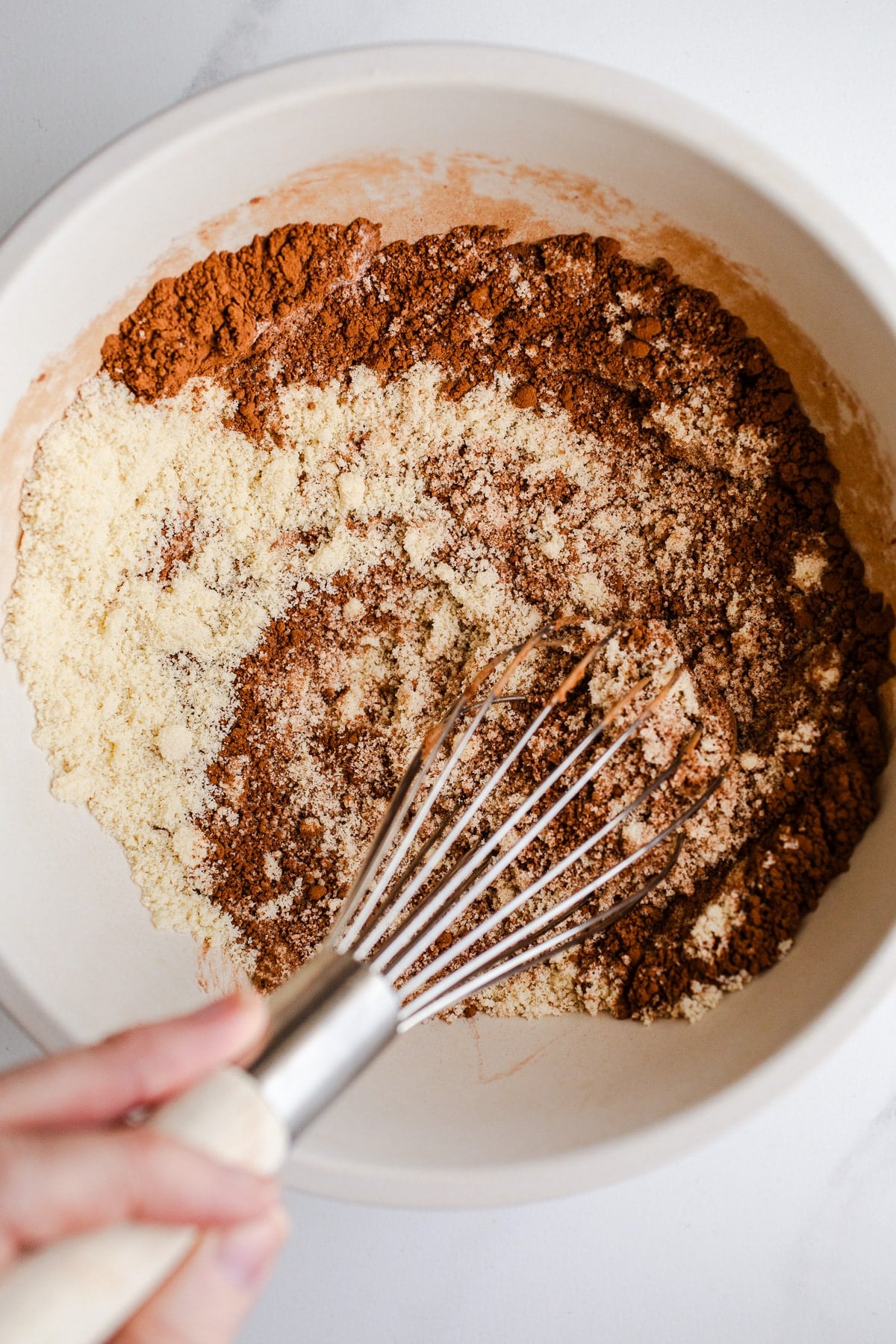 Almond flour and cocoa powder in a bowl.