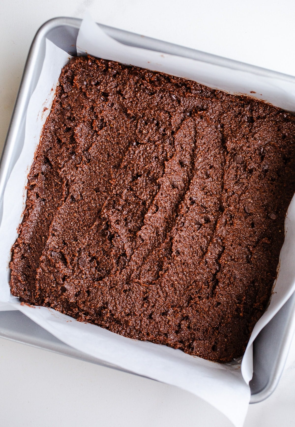 Chocolate bar batter in a baking pan.