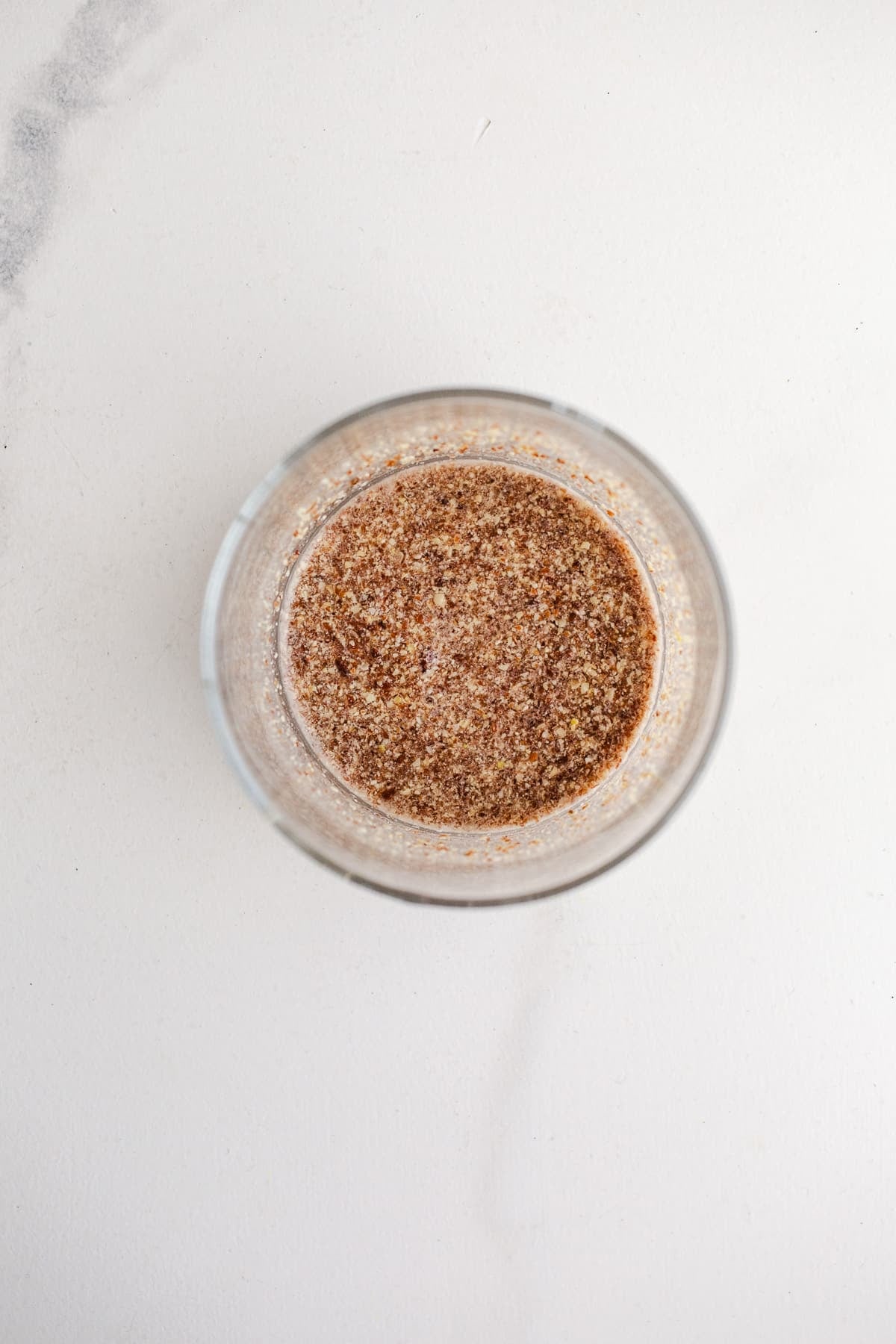 Ground flaxseed and water in a cup.