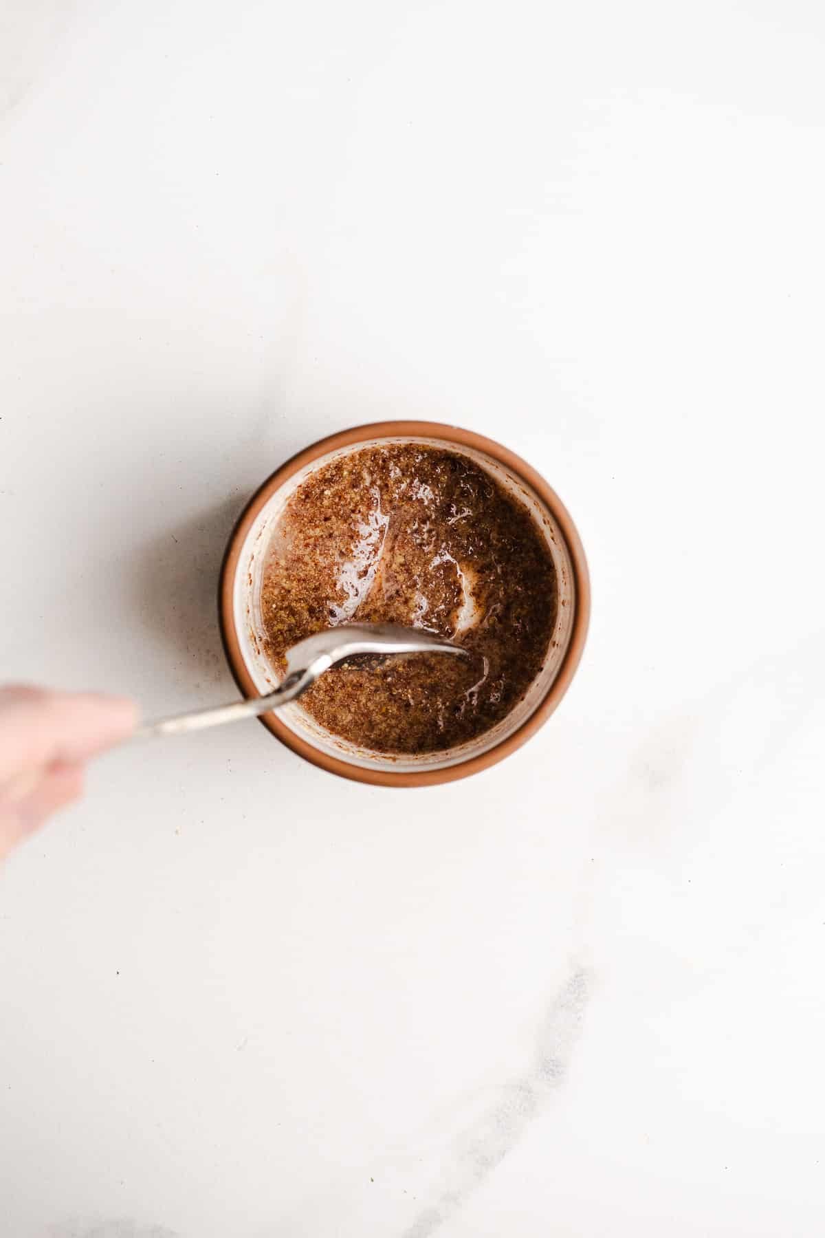 Ground flaxseed and water combined in a bowl.