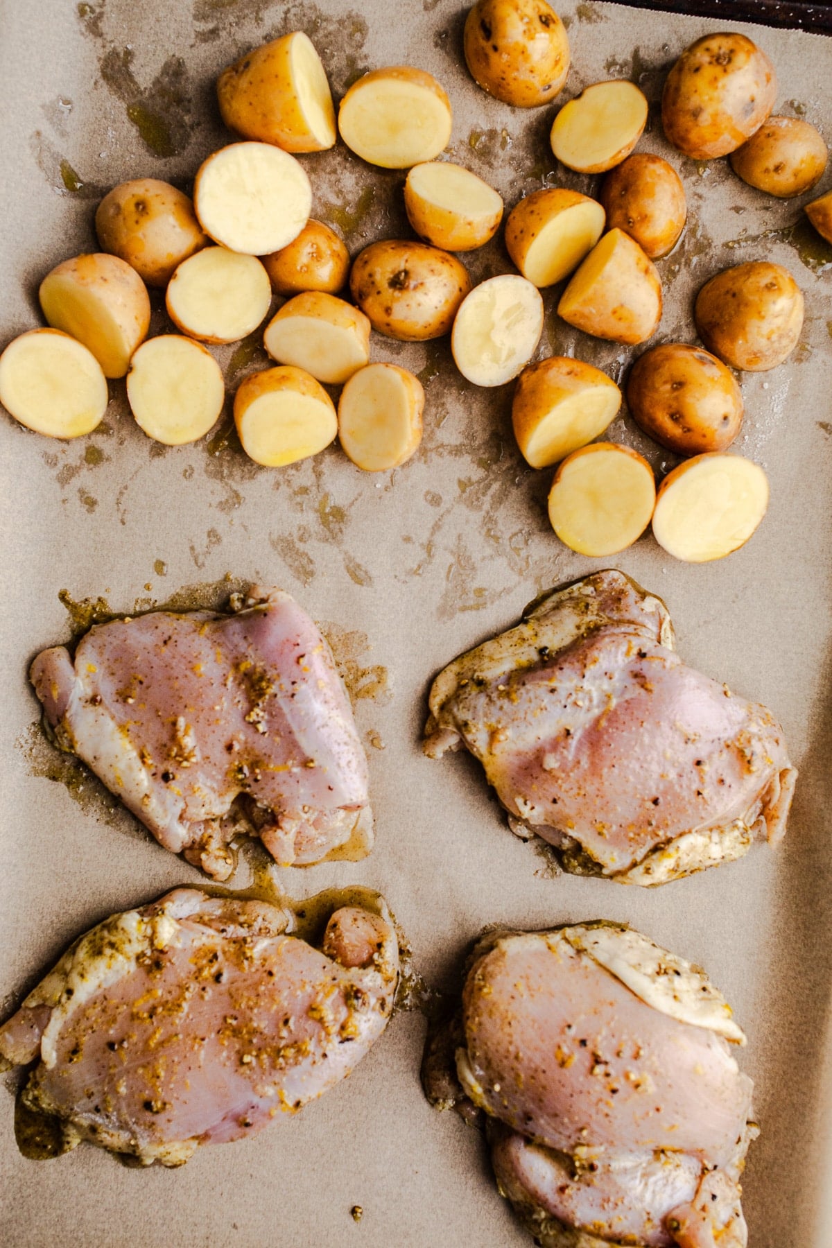 Chicken and potatoes on a sheet pan.