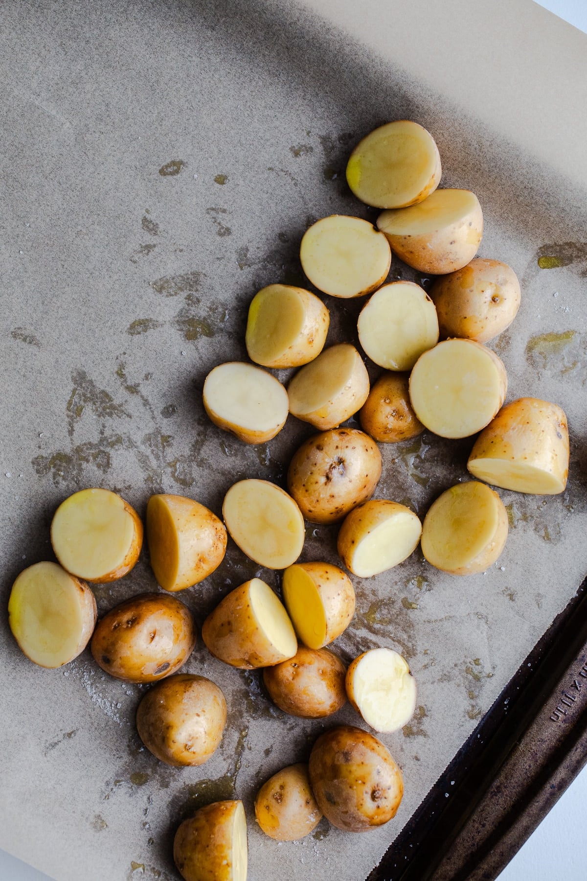 Baby potatoes on a sheet pan.