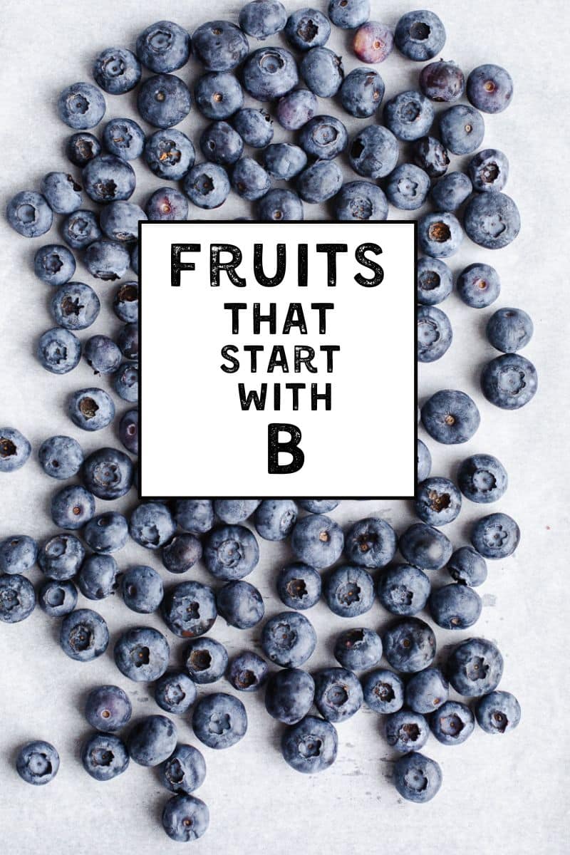 Blueberries start with the letter b are on parchment paper.
