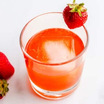 Strawberry sour with gin in a glass.