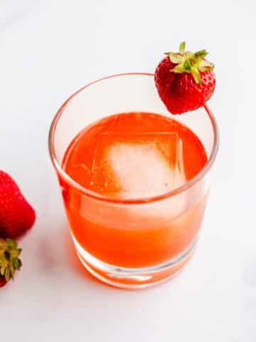 Strawberry sour with gin in a glass.