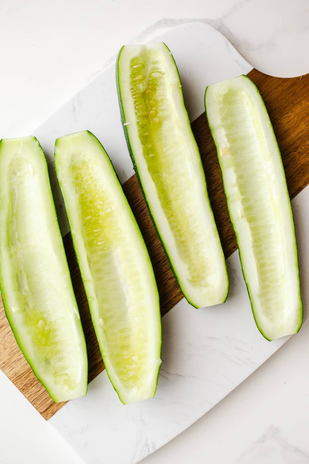 Scooped out cucumber halves.
