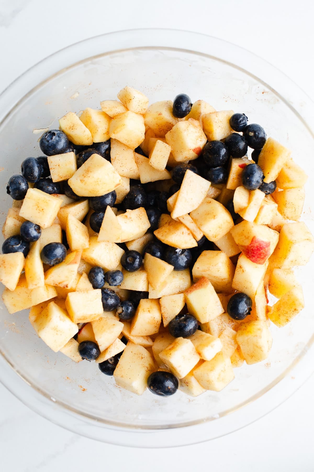 Apples and blueberries in a bowl.