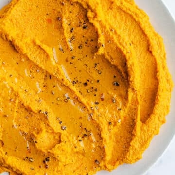 Carrot hummus in a bowl.
