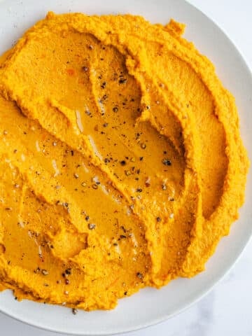 Carrot hummus in a bowl.