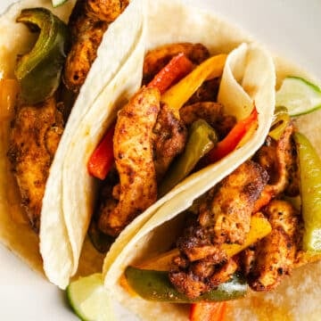 Chicken fajitas on a plate.